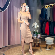 Load image into Gallery viewer, Aurora Boutique Miami beige ribbed crochet midi dress with puff sleeves and side cutouts worn by a model
