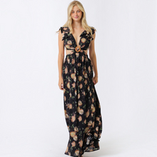 Load image into Gallery viewer, Aurora Boutique Miami Olaya floral maxi dress with ruffle sleeves, cut-out waist, and wooden ring detail on model