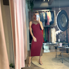 Load image into Gallery viewer, Model wearing Aurora Boutique Miami Odalys knit dress with a maroon bodice and brown side panels in a studio setting.
