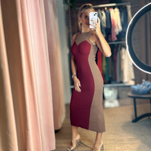 Load image into Gallery viewer, Model wearing Aurora Boutique Miami Odalys knit midi dress in burgundy and beige with a sleeveless fitted silhouette.