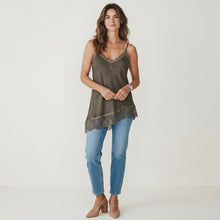 Load image into Gallery viewer, Model wearing an Aurora Boutique Miami olive green satin camisole top with delicate lace trim and blue jeans
