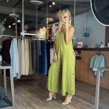 Load image into Gallery viewer, Aurora Boutique Miami Adora Tencel jumpsuit in olive green with side button details worn by a blonde model