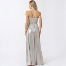 Load image into Gallery viewer, Model wearing Aurora Boutique Miami Fortul metallic silver strapless maxi dress with a smocked bodice, back view.