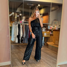 Load image into Gallery viewer, Aurora Boutique Miami Alejandria one-shoulder black jumpsuit with sequin pants worn by a model in a boutique mirror
