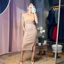 Load image into Gallery viewer, Aurora Boutique Miami beige ribbed knit midi dress with cut-out waist detail worn by a model in a boutique setting
