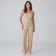 Load image into Gallery viewer, Model wearing Aurora Boutique Miami beige viscose jumpsuit with square neckline and wide-leg trousers
