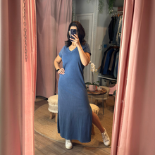 Load image into Gallery viewer, Woman wearing an Aurora Boutique Miami blue cotton v-neck t-shirt maxi dress with a side slit in a mirror selfie
