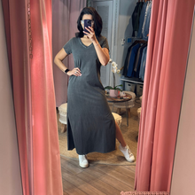 Load image into Gallery viewer, Aurora Boutique Miami Lia cotton t-shirt dress in charcoal grey with side slits, worn by a woman in a mirror selfie.
