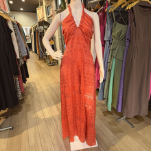 Load image into Gallery viewer, Aurora Boutique Miami Carla Romper Dress in coral lace with a halter neckline on a mannequin in a clothing store

