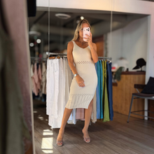 Load image into Gallery viewer, Aurora Boutique Miami Dalila ribbed knit midi dress in cream with V-neckline and openwork details worn by a model
