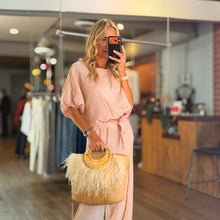 Load image into Gallery viewer, Aurora Boutique Miami Delmar linen blouse in soft pink with puff sleeves, worn by a model in a boutique setting.

