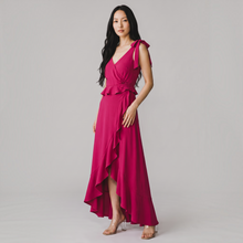 Load image into Gallery viewer, Aurora Boutique Miami Doral formal dress in fuchsia with tie shoulders, wrap bodice, and high-low ruffled hem
