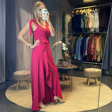 Load image into Gallery viewer, Aurora Boutique Miami Doral formal dress in vibrant fuchsia with tie shoulders and a ruffled high-low hemline.
