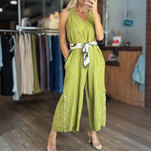 Load image into Gallery viewer, Aurora Boutique Miami lime green Tencel jumpsuit with side buttons and a patterned waist tie worn by a model
