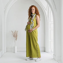 Load image into Gallery viewer, Aurora Boutique Miami Adora Tencel jumpsuit in lime green worn by a pregnant model with a floral scarf
