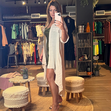 Load image into Gallery viewer, Aurora Boutique Miami Leslie high low linen cover up in beige with button front, collar, and mock pocket lapels.
