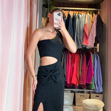 Load image into Gallery viewer, Aurora Boutique Miami Cristiana lurex crochet one-shoulder dress with side cutout and bow detail on a model
