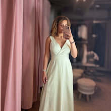 Load image into Gallery viewer, Aurora Boutique Miami Kara Minty tied maxi dress in light green worn by a model in a boutique fitting room
