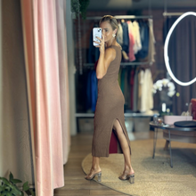 Load image into Gallery viewer, Aurora Boutique Miami Odalys knit midi dress in brown with a side slit, worn by a model in a boutique mirror selfie.
