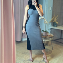 Load image into Gallery viewer, Model wearing Aurora Boutique Miami Odalys knit midi dress with grey ribbed front and black side panels
