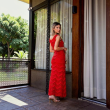 Load image into Gallery viewer, Model wearing a vibrant red Aurora Boutique Miami Valentina crochet maxi dress with tiered scalloped hem details
