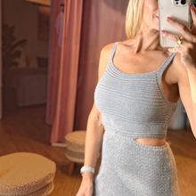 Load image into Gallery viewer, Aurora Boutique Miami silver lurex crochet dress with a scoop neck and side cutouts worn by a blonde model

