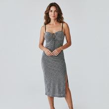 Load image into Gallery viewer, Model wearing Aurora Boutique Miami silver lurex midi dress with spaghetti straps and side slit
