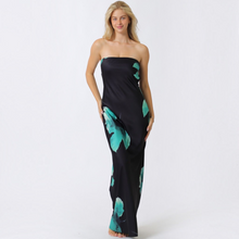 Load image into Gallery viewer, Model wearing Aurora Boutique Miami Caceres strapless black maxi dress with teal floral print and back chest tie
