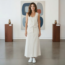 Load image into Gallery viewer, Model wearing Aurora Boutique Miami Suzanne Skirt Set, a cream sleeveless vest and matching midi skirt in a gallery.
